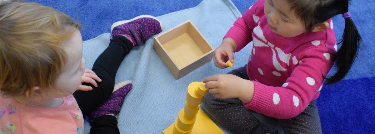 Girls playing with blocks at a daycare