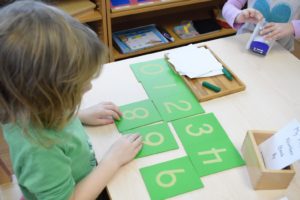 Montessori Kirkland childcare where child is solving numbers