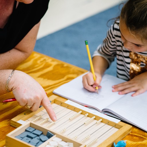 Teacher helping with homework.