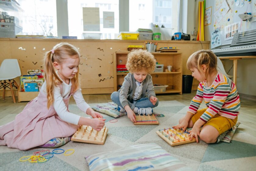 Preschool-students-playing-with-geoboard-wrapping.