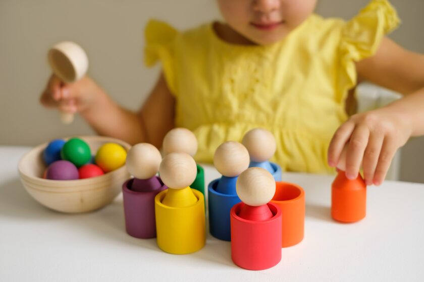 Little girl playing with blocks.